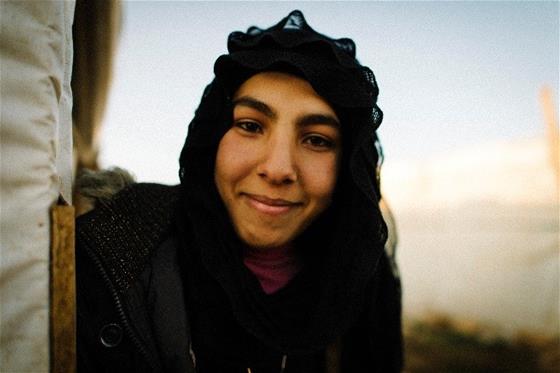 Afaf, a smiling Syrian refugee in Lebanon, who desires an education to be a math teacher