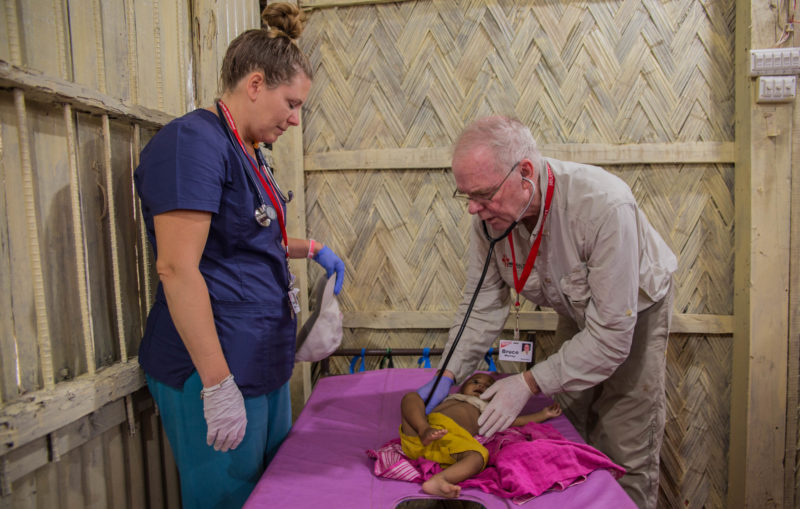 Nurse Becca and Dr. Murray treat a young refugee in a Medical Teams clinic at the Kutupalong Settlement in Bangladesh