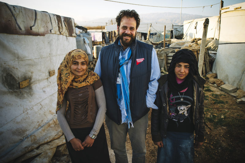 Roger Sandberg, vice president of International Field Operations, in Lebanon with Syrian refugees Kareena, left, and her sister Afaf