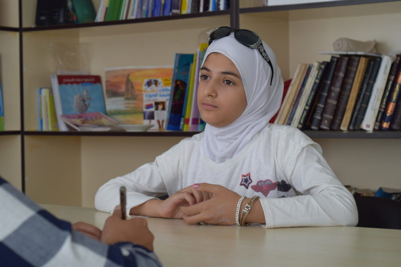 Aliaa, a Syrian girl who now lives in Turkey, sitting with a psychiatrist to work through psychological trauma
