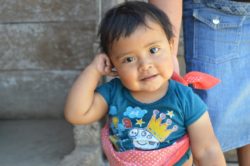 A Guatemalan baby, Eric, smiling into the camera