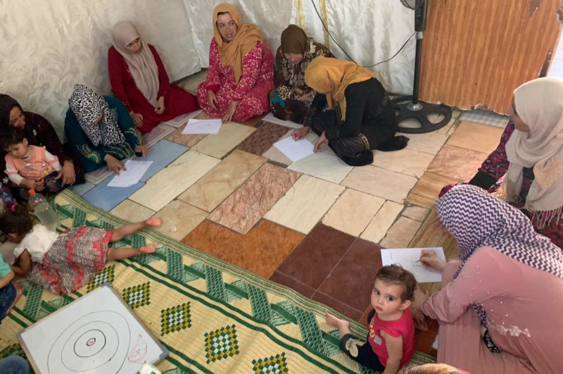 A group of Syrian refugee mothers meet in a support group in Lebanon, 2019.