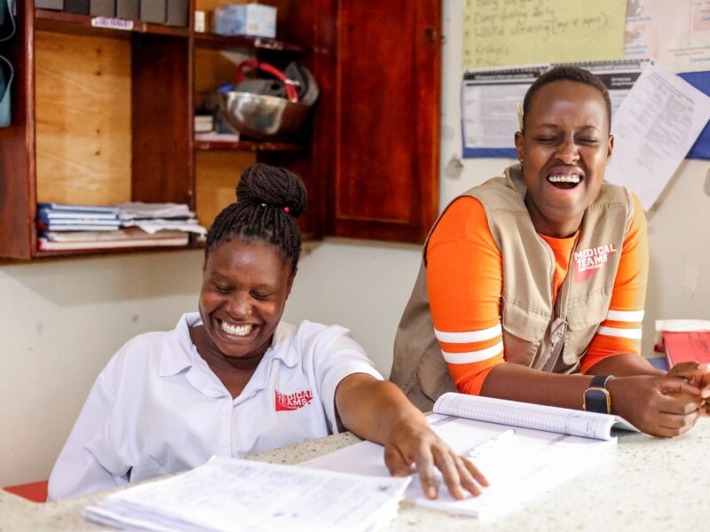 Medical Teams staff laugh together in the maternal ward in Uganda